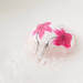 Pink floral design on a white background
