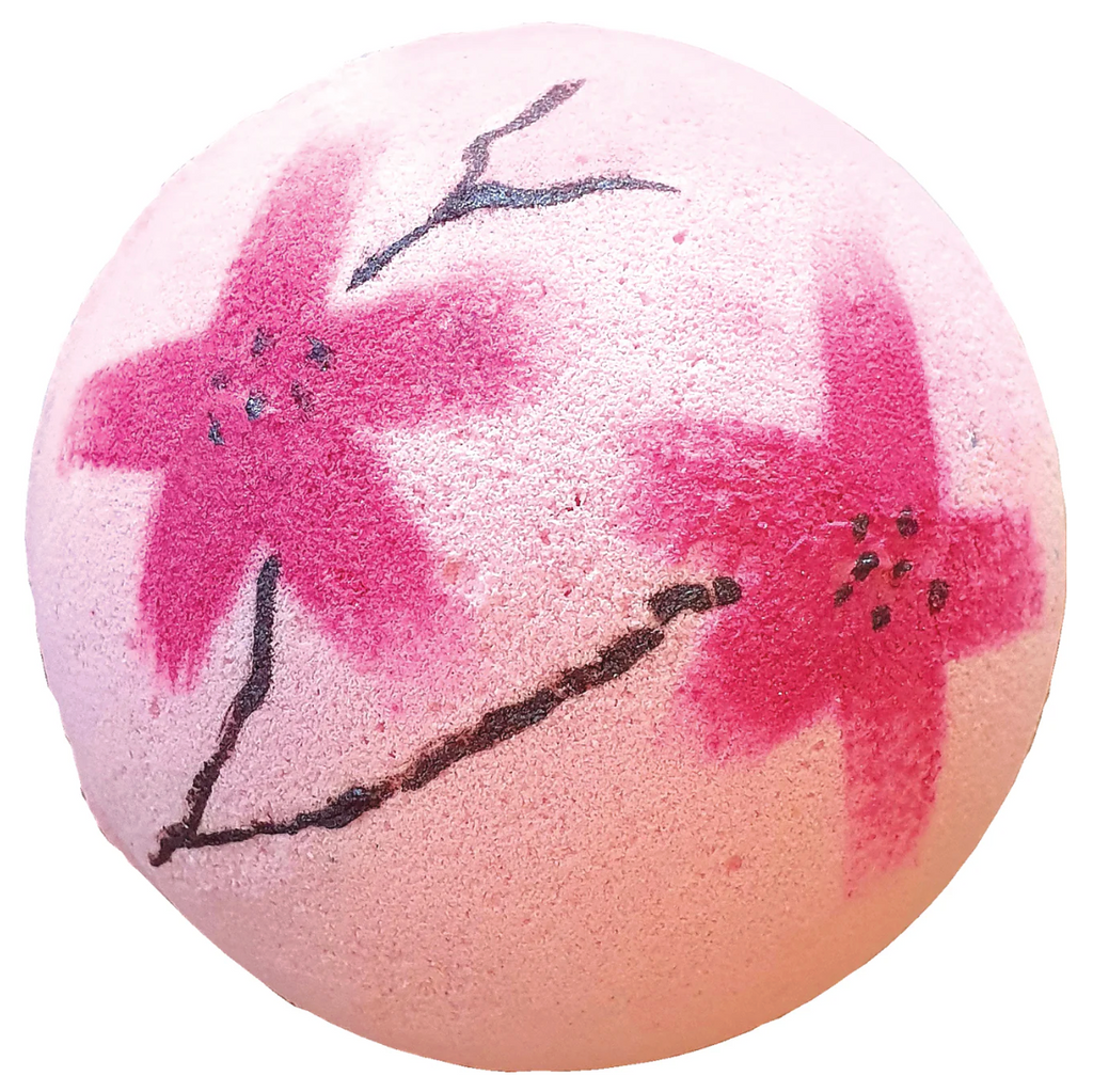 Bath bomb with cherry blossom design on a white background