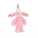 Pink bunny keychain with floral details on a white background