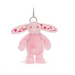 Pink plush bunny keychain with floral ear accents on a white background