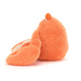 Orange plush crab from the side view on a white background