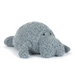Plush toy manatee on a white background