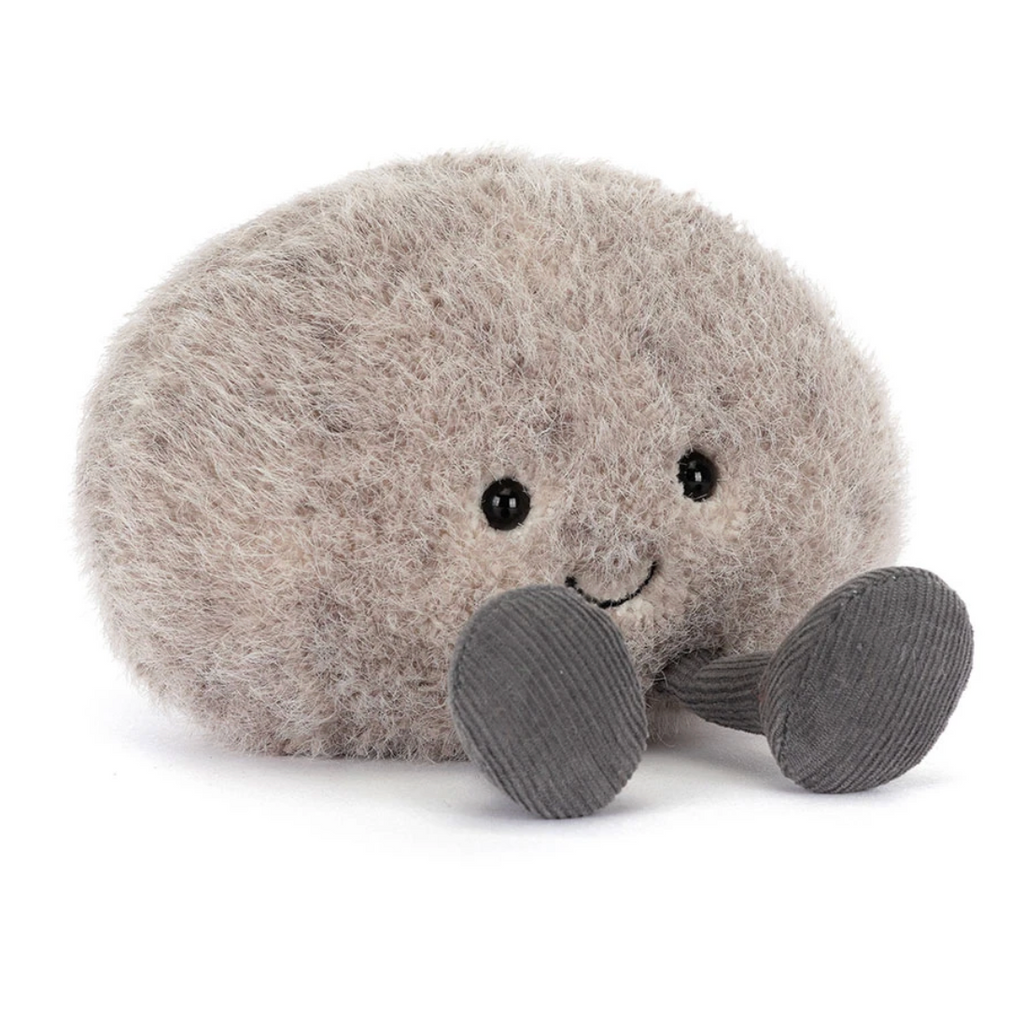 Plush toy resembling a pebble on a white background