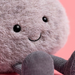 Close-up of a plush toy with a pink background