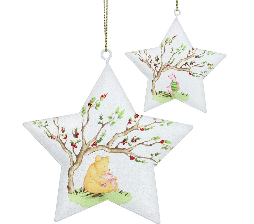 Two white star-shaped hanging ornaments featuring a watercolor-style tree with red berries and Winnie the Pooh sitting under it, shown on a plain white background.