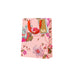 Floral-patterned gift bag with a visible brand tag on a white background