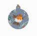 Decorative round tag with a robin design on a blue background