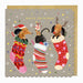 Christmas card with dogs in stockings and reindeer antlers on a gray background
