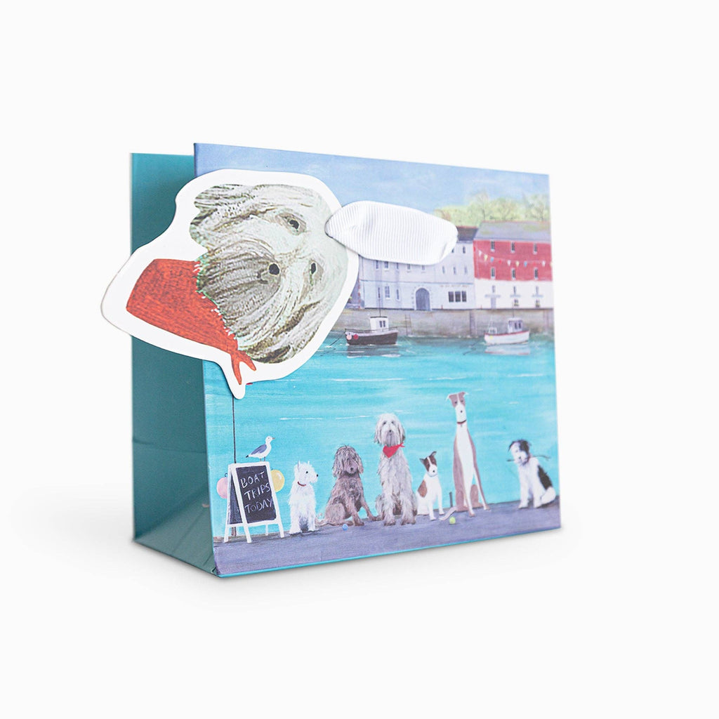 Greeting card with a design of dogs by a waterfront scene