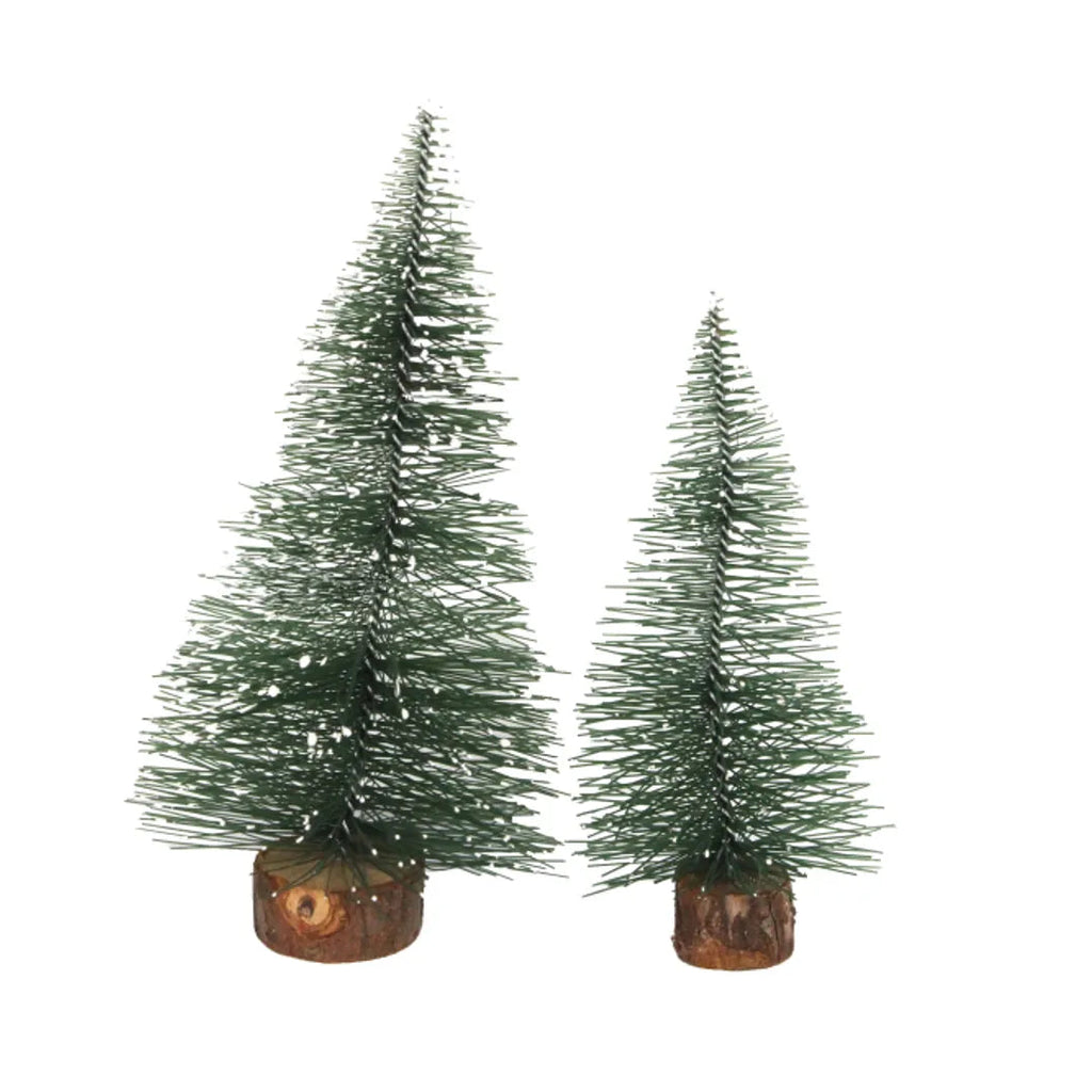 Two small artificial Christmas trees with white snow-like dusting, one tall and one short, both mounted on brown faux wood bases, shown on a plain white background.
