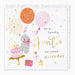 Birthday card for a lovely Auntie with balloons, dog, cake, and presents on a white background.