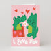 Mrs Best Paper Co. Valentine card featuring two green crocodiles in love with hearts and I Love You text on pink