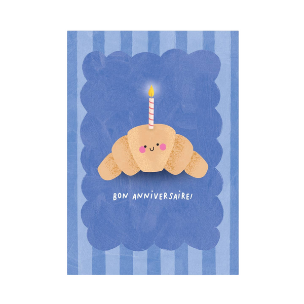 Mrs Best Paper Co. birthday card featuring a cute illustrated croissant with a candle on a blue striped background.