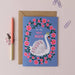 Mrs Best Paper Co. greeting card featuring a swan with a crown inside a floral wreath, with a kraft envelope.