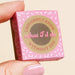 Pink and brown box with text 'I doughnut know what I'd do without you' held by a hand.
