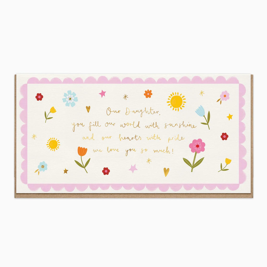 A rectangular greeting card with a scalloped pink border and a message for 'Our Daughter' in gold script, decorated with small colorful flowers and stars on a cream background.