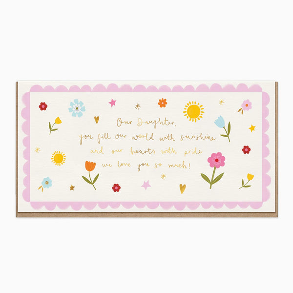 A rectangular greeting card with a scalloped pink border and a message for 'Our Daughter' in gold script, decorated with small colorful flowers and stars on a cream background.