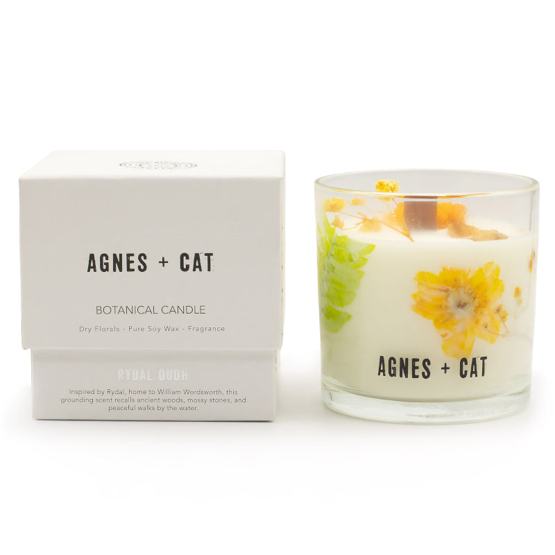 Agnes + Cat botanical candle with packaging on a white background